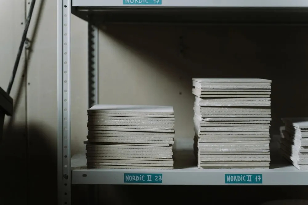 Stacked ceramic material samples on shelves