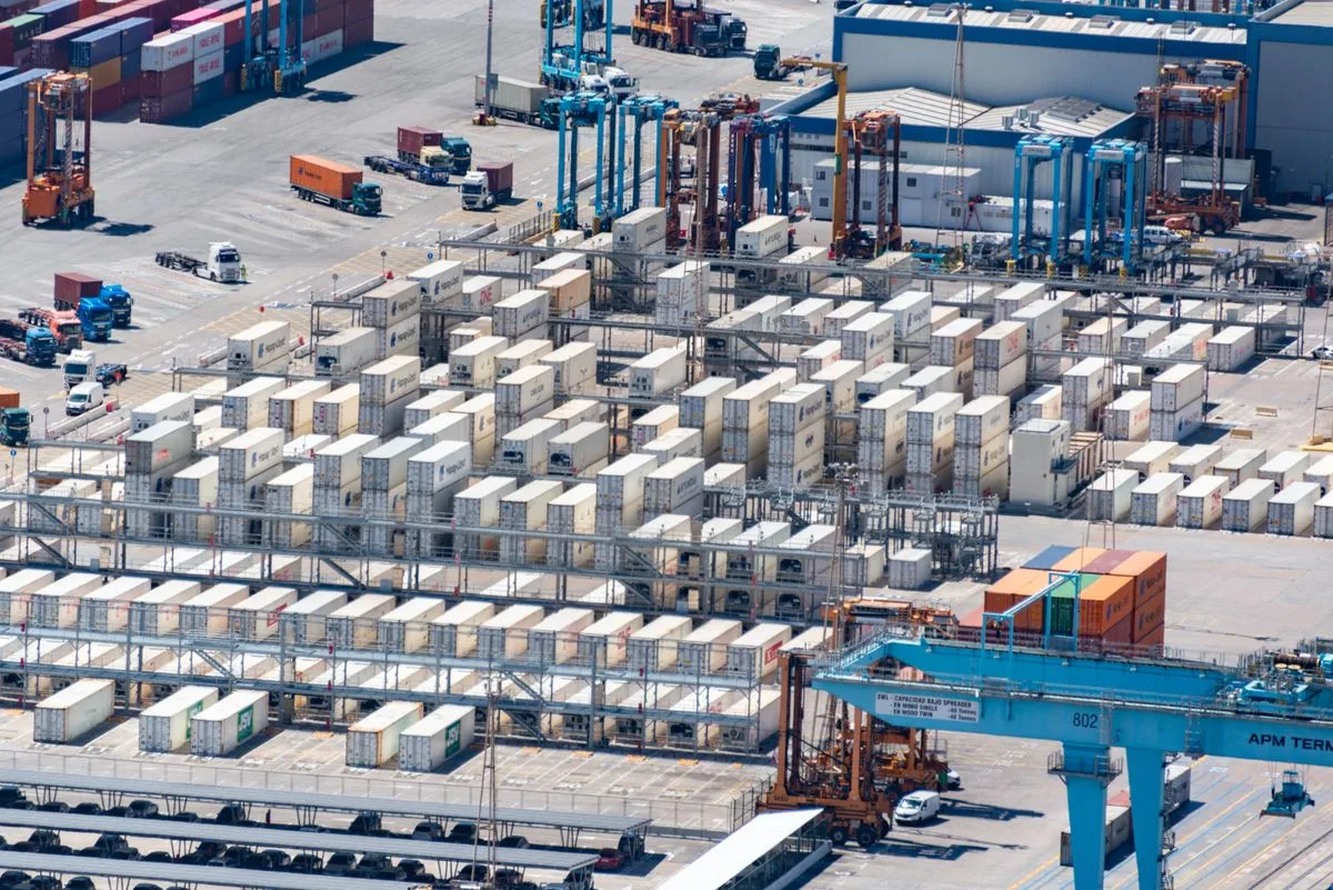 Containers and trucks at a logistics facility