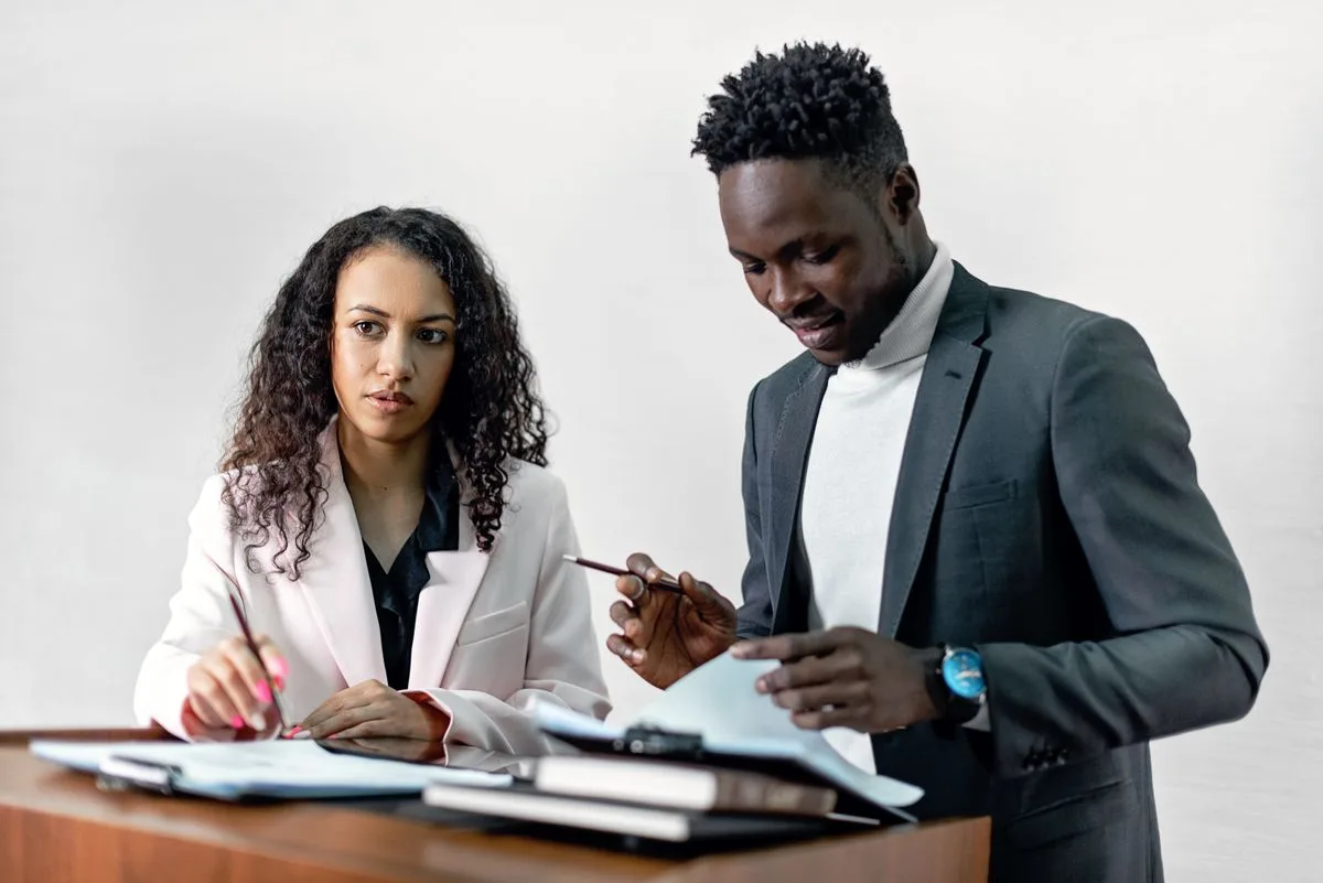 Business professionals reviewing a contract together