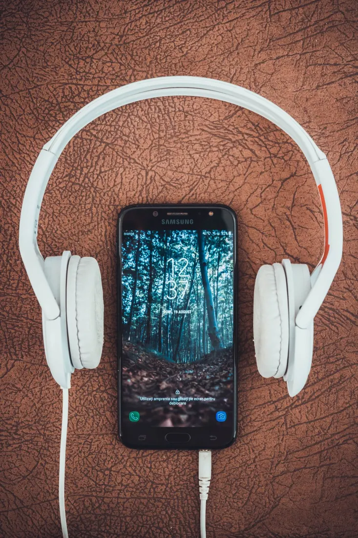 Headphones beside a mobile device